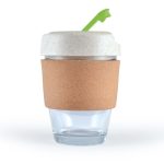 A reusable coffee cup with a cork band and a white lid featuring a green straw. The cup is made of transparent glass.