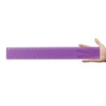 A transparent purple 30cm ruler held in a hand, featuring clear measurement markings.