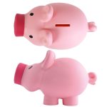 A pink pig-shaped coin bank with a slot for coins and a round base. It features a simple design and a soft finish.