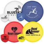 A collection of colorful flying discs in red, yellow, blue, and white, featuring various logos and branding.
