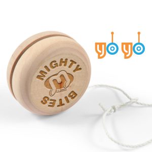 A wooden yo-yo featuring a circular design with "Mighty Bits" engraved on one side and attached string for play.