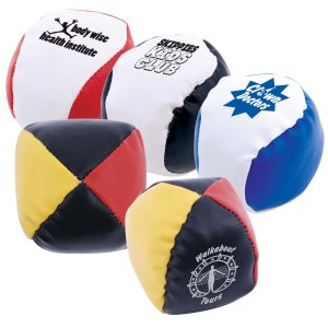 A set of colorful Ace Hacky Sacks featuring various logos and designs, including red, white, yellow, and blue patterns.