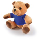 A plush teddy bear with a light brown body and a blue shirt, featuring soft, rounded ears and dark eyes.