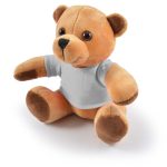 A plush teddy bear with light brown fur and dark brown accents, wearing a plain gray shirt.