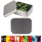 Silver rectangular tin filled with green and black jelly beans, with a variety of colorful jelly beans displayed below.