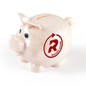 A small speckled pink piggy bank with a logo, featuring large eyes and a coin slot on top.