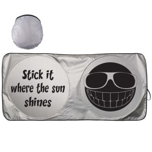 A silver sunshade featuring a smiley face and humorous text, folded in a circular shape.