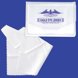 A white microfibre lens cleaning cloth with a clear case, featuring a logo and a textured edge.