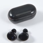 Black Tempest TWS earbuds with a matching charging case, showcasing a sleek and modern design.