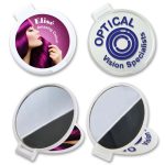 Round folding mirror with a colorful design featuring a woman with vibrant purple hair. White casing with a logo.