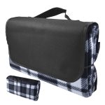 A black and white checkered picnic blanket, folded with a carrying handle. It features a sleek black exterior.