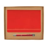 A red notebook with an elastic band and a silver pen are neatly presented in a cardboard gift box.