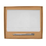 A white notebook and a silver pen are displayed in a brown cardboard gift set box.