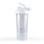 A clear protein shaker with a white lid and spout, featuring a spiral mixing ball inside.