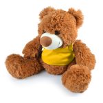 A plush teddy bear with a fluffy texture and a friendly face, wearing a yellow shirt.