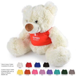 A plush teddy bear with a cream-colored body and a red shirt, featuring a sewn logo.