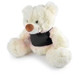 A stuffed plush teddy bear in cream with a brown nose, wearing a black vest, sits with its arms and legs spread out.