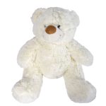 A plush teddy bear named Coconut, featuring a soft white exterior and a brown nose, perfect for cuddling.