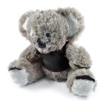 A plush koala toy named Korporate Koala, featuring soft fur and a friendly expression, wearing a black vest.