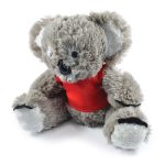 A plush toy koala with gray fur and a red shirt. The toy has a friendly face and plush limbs.