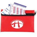 A red first aid kit containing bandages, with a zipper closure and a logo on the front.