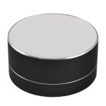A round black Bluetooth speaker with a perforated silver top, designed for portability and stylish audio delivery.