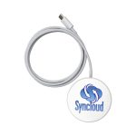 A round white wireless charger with a grey cable and a logo on the top.