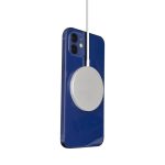 A magnetic wireless charger in silver attached to a blue smartphone. Features a sleek design with a charging cable.