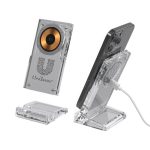 A clear acrylic wireless charging stand with a golden charging pad, designed for smartphones, featuring a logo.