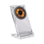 A clear acrylic wireless charging stand featuring a circular charging pad with a gold and black centre.