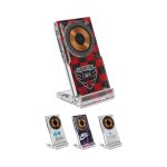 A wireless charging stand featuring a red and black plaid design, with a gold speaker-like element and a clear base.