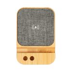 A wireless charger featuring a bamboo base and grey fabric surface, designed for eco-friendly charging.