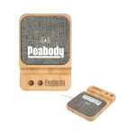 A wooden wireless charger with a textured grey top and a logo. It features two holes beneath the charging surface.