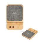 A bamboo wireless charger with a grey fabric surface, featuring a logo and slots for charging cable storage.