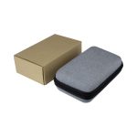 A grey zippered case with a cardboard box beside it. The case is compact and rectangular in shape.