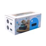 A wireless charging speaker and alarm clock in a box, featuring a dark exterior and display for time settings.