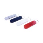 A set of four flash drives in silver, navy blue, white, and red, each with a keyring attachment.