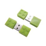 A green building block-shaped flash drive with a removable cap, featuring a silver USB connector.