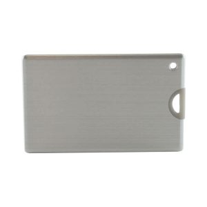 A sleek silver credit card-sized flash drive with a rounded corner and a hole for attachment, featuring a logo.