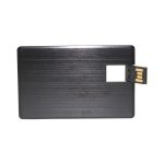 A sleek black credit card-sized flash drive with a brushed metal finish and a retractable USB connector.