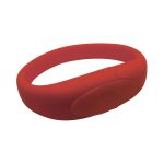 A red silicone wristband with a smooth surface and a logo. The band is flexible and designed for various events.