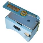 A blue box containing virtual reality glasses, with an open lid and a smartphone visible inside.