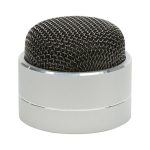 A compact silver Bluetooth speaker with a black mesh top design. It features a sleek, rounded shape and a branding logo.