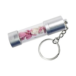A silver storage LED USB drive in a transparent casing, featuring decorative pink and white shapes, attached to a keychain.