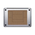 A silver laptop stand with a textured brown surface on top, featuring various cutouts for ventilation.