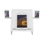 A white foldable laptop stand with slots for a tablet in the centre and two smartphones on the sides.