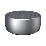 A round, silver wireless speaker with a mesh top, featuring a sleek and modern design.