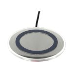 A round silver wireless charger with a black ring around the centre and a connected cable.