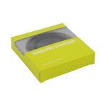 A green packaging box containing a circular wireless charger, featuring a transparent window and a logo.