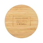 A round bamboo wireless charger with a smooth surface and a hidden logo on the bottom.